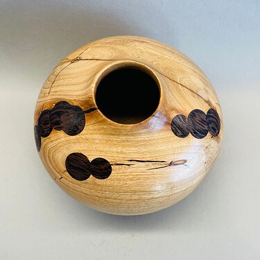 Hollow form with wenge coins