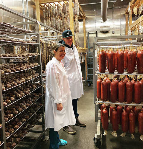 Chris and Mollie Eley inside one of Smoking Gooses Aging Rooms