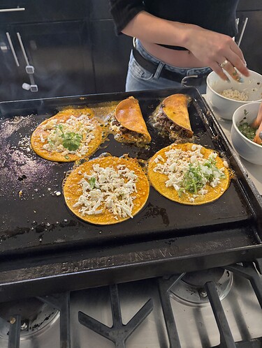 Layer of Oaxacan cheese, cilantro/onion next and then a nice bit of beef