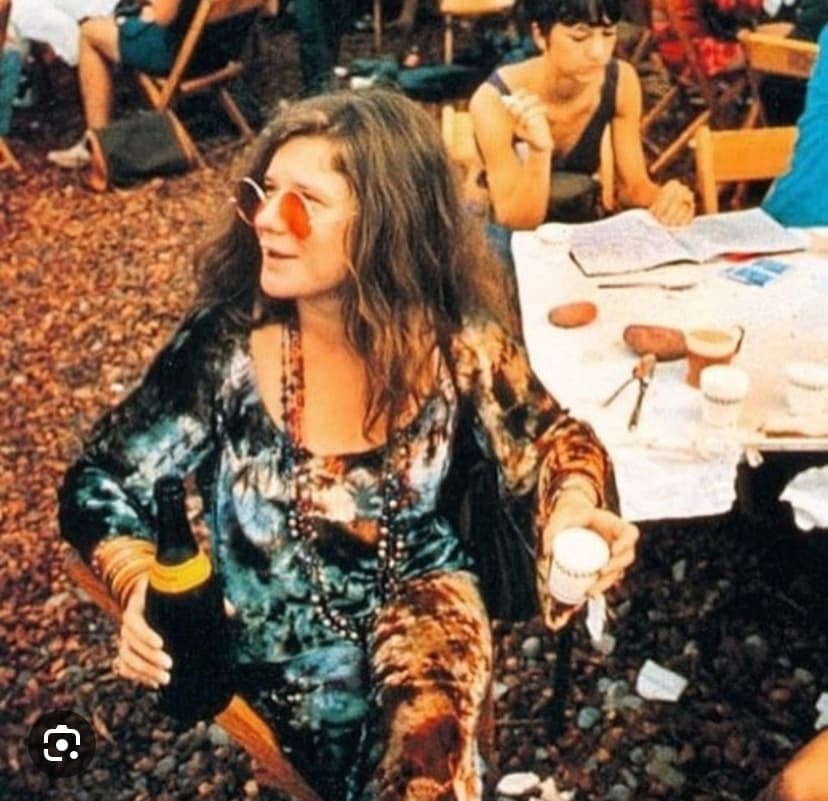 Janis Joplin with Bottle of Bubbles at Woodstock