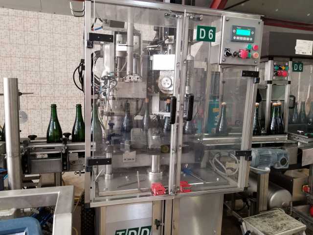 Right after disgorging, the cork and cage is added.jpg