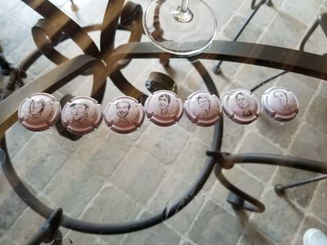 The bottle caps showing the faces of those who bring life to Marie Courtin.jpg